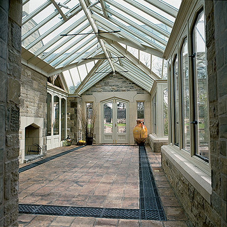 Traditional floor grilles in a stone floor.