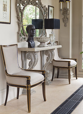 Underfloor heating leaves the walls clear for consoles and side tables.